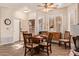 Bright dining area features a wooden table set for six, wood floors and plantation shutters at 5450 E Mclellan Rd # 150, Mesa, AZ 85205