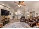 Cozy living room showcases hardwood floors, leather seating, and backyard views at 5450 E Mclellan Rd # 150, Mesa, AZ 85205