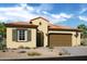Charming single-story home featuring a tile roof, stucco exterior, and a two-car garage at 6094 N Sunrise Ln, Buckeye, AZ 85396