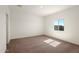 Bright bedroom with neutral carpet and window providing natural light at 652 W Pintail Dr, Casa Grande, AZ 85122