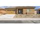 Charming single-story home with a two-car garage and low maintenance desert landscape at 652 W Pintail Dr, Casa Grande, AZ 85122