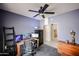 A small bedroom with a desk, computer, and ceiling fan at 656 W Johnson Dr, Gilbert, AZ 85233