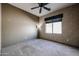 An empty bedroom featuring neutral-colored walls and carpet, with a window at 656 W Johnson Dr, Gilbert, AZ 85233