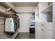 Walk-in closet with built in shelves and drawers, and hanging racks for optimal storage solutions at 656 W Johnson Dr, Gilbert, AZ 85233