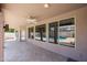 Spacious covered patio with tiled floor, ceiling fan, and views of the pool at 656 W Johnson Dr, Gilbert, AZ 85233