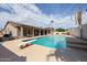 Enjoy a refreshing swim in this sparkling pool, featuring a diving board and landscaped surroundings at 656 W Johnson Dr, Gilbert, AZ 85233