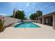 Sparkling private pool surrounded by mature landscaping and a covered patio perfect for entertaining at 656 W Johnson Dr, Gilbert, AZ 85233