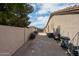 View of the spacious side yard with block fencing and ample room for storage or customization at 656 W Johnson Dr, Gilbert, AZ 85233