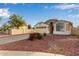 Attractive home boasting a spacious driveway, vibrant landscaping, and well-maintained facade in a serene setting at 7215 N 76Th Ave, Glendale, AZ 85303