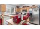 Bright kitchen with stainless appliances, including microwave and refrigerator at 7215 N 76Th Ave, Glendale, AZ 85303