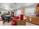 Bright kitchen connected to a living area with stainless steel sink and oak cabinetry at 7215 N 76Th Ave, Glendale, AZ 85303