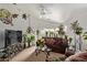 Inviting living room with plush brown sofa and an abundance of natural light with many houseplants at 7215 N 76Th Ave, Glendale, AZ 85303