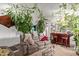 Cozy living room with a mini bar, lots of indoor plants, and comfortable seating, perfect for relaxation at 7215 N 76Th Ave, Glendale, AZ 85303