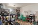 Versatile room providing ample storage space with shelves, containers, and exercise equipment at 7215 N 76Th Ave, Glendale, AZ 85303