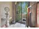 View of the decorative iron entry gate leading to a serene outdoor space with garden views at 7517 E Mariposa Grande Dr, Scottsdale, AZ 85255