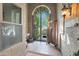 Entry gate with courtyard beyond, stone detail, tile flooring, and welcome area at 7517 E Mariposa Grande Dr, Scottsdale, AZ 85255