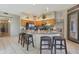 Charming kitchen features wood cabinetry, granite countertops, and an island at 7517 E Mariposa Grande Dr, Scottsdale, AZ 85255