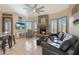 Bright living room showcases a stone fireplace, comfortable seating, and shutters at 7517 E Mariposa Grande Dr, Scottsdale, AZ 85255