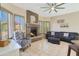 Cozy living room with a beautiful stone fireplace and relaxing seating at 7517 E Mariposa Grande Dr, Scottsdale, AZ 85255