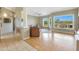 Bright and airy living room featuring hardwood floors, large windows, and views of the outdoor landscape at 7517 E Mariposa Grande Dr, Scottsdale, AZ 85255