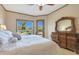Bright bedroom with a view of the sparkling swimming pool and backyard at 7517 E Mariposa Grande Dr, Scottsdale, AZ 85255