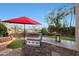 Backyard built-in stainless steel gas grill and granite countertop perfect for outdoor entertaining at 7517 E Mariposa Grande Dr, Scottsdale, AZ 85255