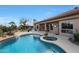 Inviting backyard pool and spa with covered patio and outdoor kitchen area, perfect for entertaining at 7517 E Mariposa Grande Dr, Scottsdale, AZ 85255