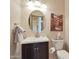 Cozy powder room, with modern fixtures, decor, and neutral color palette at 7517 E Mariposa Grande Dr, Scottsdale, AZ 85255