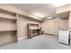 Finished basement space with shelving, counter, and deep freezer at 823 W Palo Verde Dr, Phoenix, AZ 85013