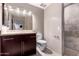 Modern bathroom featuring a tiled shower, stylish vanity, and neutral color palette at 823 W Palo Verde Dr, Phoenix, AZ 85013