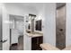 Bathroom featuring a vanity with a beautiful stone countertop and tiled walk-in shower at 823 W Palo Verde Dr, Phoenix, AZ 85013