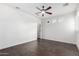 Spacious bedroom with hardwood floors, ceiling fan, and bright windows at 823 W Palo Verde Dr, Phoenix, AZ 85013