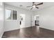 Bedroom with hardwood floors featuring an ensuite bathroom and easy access to the hall at 823 W Palo Verde Dr, Phoenix, AZ 85013