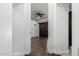 The primary bedroom features hardwood floors, a ceiling fan, and a dark wood sliding barn door to the backyard at 823 W Palo Verde Dr, Phoenix, AZ 85013