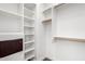 Walk-in closet offers ample storage with built-in shelving and wooden closet rods at 823 W Palo Verde Dr, Phoenix, AZ 85013