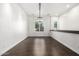 Bright dining room features hardwood floors, chandelier, and large window at 823 W Palo Verde Dr, Phoenix, AZ 85013