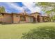 Stunning exterior of the home with a well-manicured front lawn and beautiful desert landscaping at 823 W Palo Verde Dr, Phoenix, AZ 85013