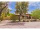 Well-kept single-story home with neatly trimmed shrubs, a verdant lawn, and attractive architectural details at 823 W Palo Verde Dr, Phoenix, AZ 85013
