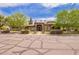 Charming home featuring a manicured lawn, blooming shrubs, and a welcoming entrance framed by columns at 823 W Palo Verde Dr, Phoenix, AZ 85013