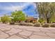 Lovely home featuring lush landscaping, mature trees, and a welcoming front facade with stone accents at 823 W Palo Verde Dr, Phoenix, AZ 85013