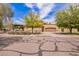 Beautiful single-Gathering home with a three car garage, lush landscaping, and circular driveway at 823 W Palo Verde Dr, Phoenix, AZ 85013