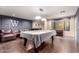 Bright and spacious game room featuring a pool table, bar area, and comfortable seating at 823 W Palo Verde Dr, Phoenix, AZ 85013