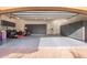 Spacious garage featuring ample storage cabinets, painted floor and overhead lighting at 823 W Palo Verde Dr, Phoenix, AZ 85013