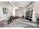 Well-organized garage with storage racks, painted floor, overhead lighting and multiple doors at 823 W Palo Verde Dr, Phoenix, AZ 85013