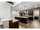 Spacious kitchen with dual islands, dark wood cabinetry, brick backsplash, and modern stainless steel appliances at 823 W Palo Verde Dr, Phoenix, AZ 85013