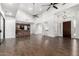 Great room featuring tall ceilings, dark wood floors, and an open floor plan that leads to the kitchen at 823 W Palo Verde Dr, Phoenix, AZ 85013
