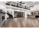 Expansive open floor plan with high ceilings and dark hardwood flooring, fireplace, and bar area at 823 W Palo Verde Dr, Phoenix, AZ 85013