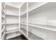 Spacious walk-in pantry offers ample storage with custom shelving and patterned shelf liners at 823 W Palo Verde Dr, Phoenix, AZ 85013