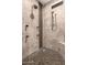 Luxurious shower with multiple shower heads and detailed tilework at 823 W Palo Verde Dr, Phoenix, AZ 85013