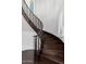 Elegant curved staircase with dark wood treads and white walls featuring louvered windows at 823 W Palo Verde Dr, Phoenix, AZ 85013